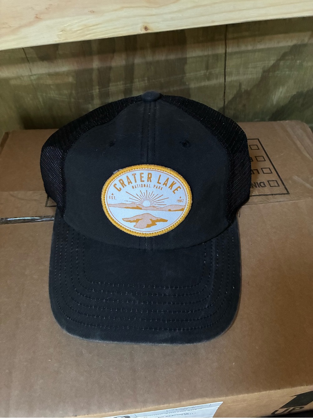 American Needle Black Trucker Hat with Gold & White Crater Lake Patch